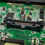 Close-up of a green circuit board with various electronic components