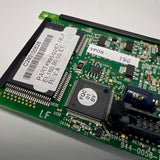Close-up of a computer memory module with chips and labels on a white background